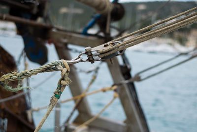 Close-up of rope tied to bollard
