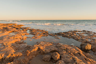 Scenic view of sea against clear sky