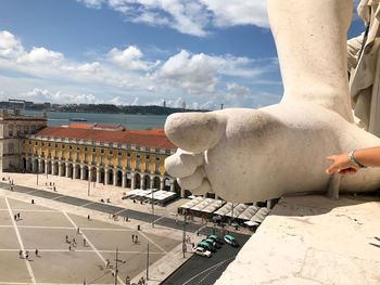 Midsection of man against cloudy sky