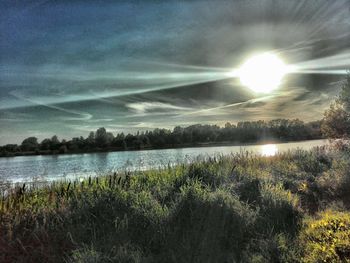 Scenic view of calm lake against sky