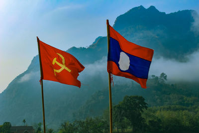 Low angle view of flag against sky