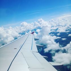 Low angle view of airplane flying in sky