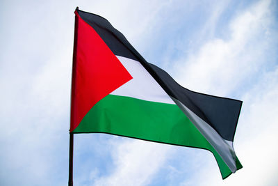 Low angle view of flag against sky