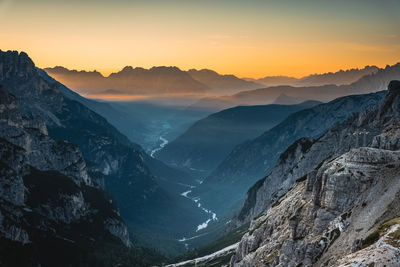 Scenic view of mountains against sky during sunset