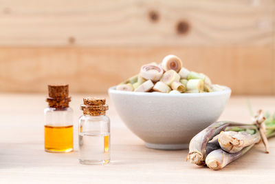 Close-up of scallion with essential oils on table