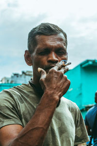 Portrait of man against sky