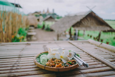 Close-up of food on table against building