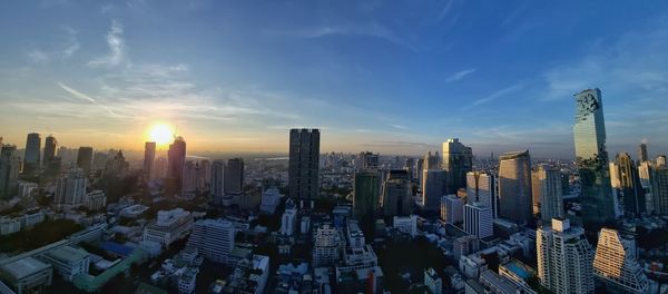 Cityscape against sky during sunset