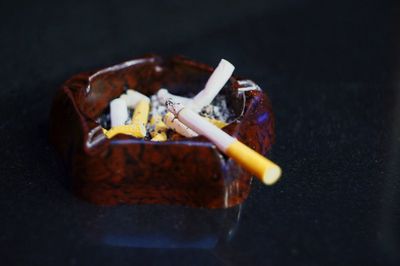 Close-up of cigarette in container