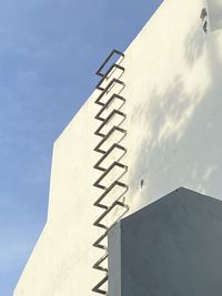 Low angle view of building against clear blue sky