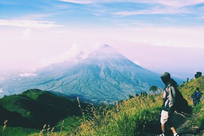 Woman hiking on mountain landscape