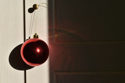 Close-up of christmas ornament hanging on door