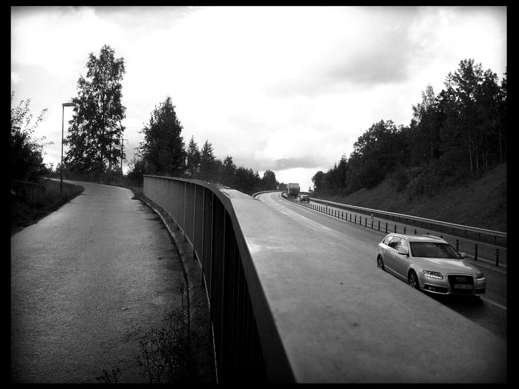 transportation, mode of transport, car, sky, land vehicle, the way forward, road, tree, diminishing perspective, cloud - sky, transfer print, vanishing point, auto post production filter, road marking, travel, cloud, cloudy, street, country road, on the move