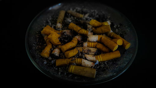 High angle view of cigarette in container