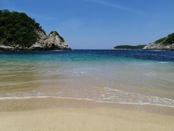 Scenic view of sea against clear blue sky