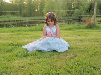 Girl sitting on field