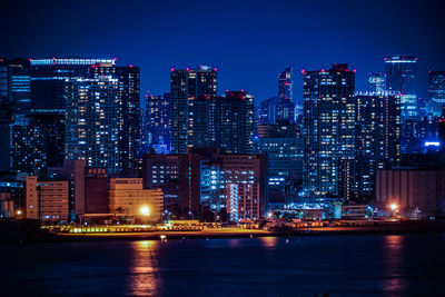 Illuminated buildings in city at night