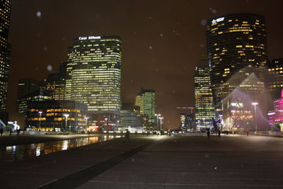 Illuminated city buildings at night