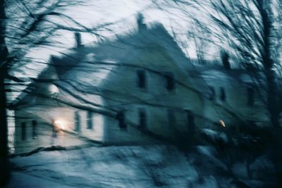 Blurred motion of building by street during winter