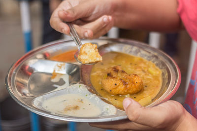 Close-up of hand holding ice cream