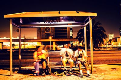 Full length of woman sitting on bench