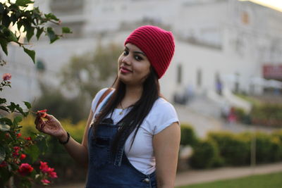 Young woman wearing hat standing outdoors