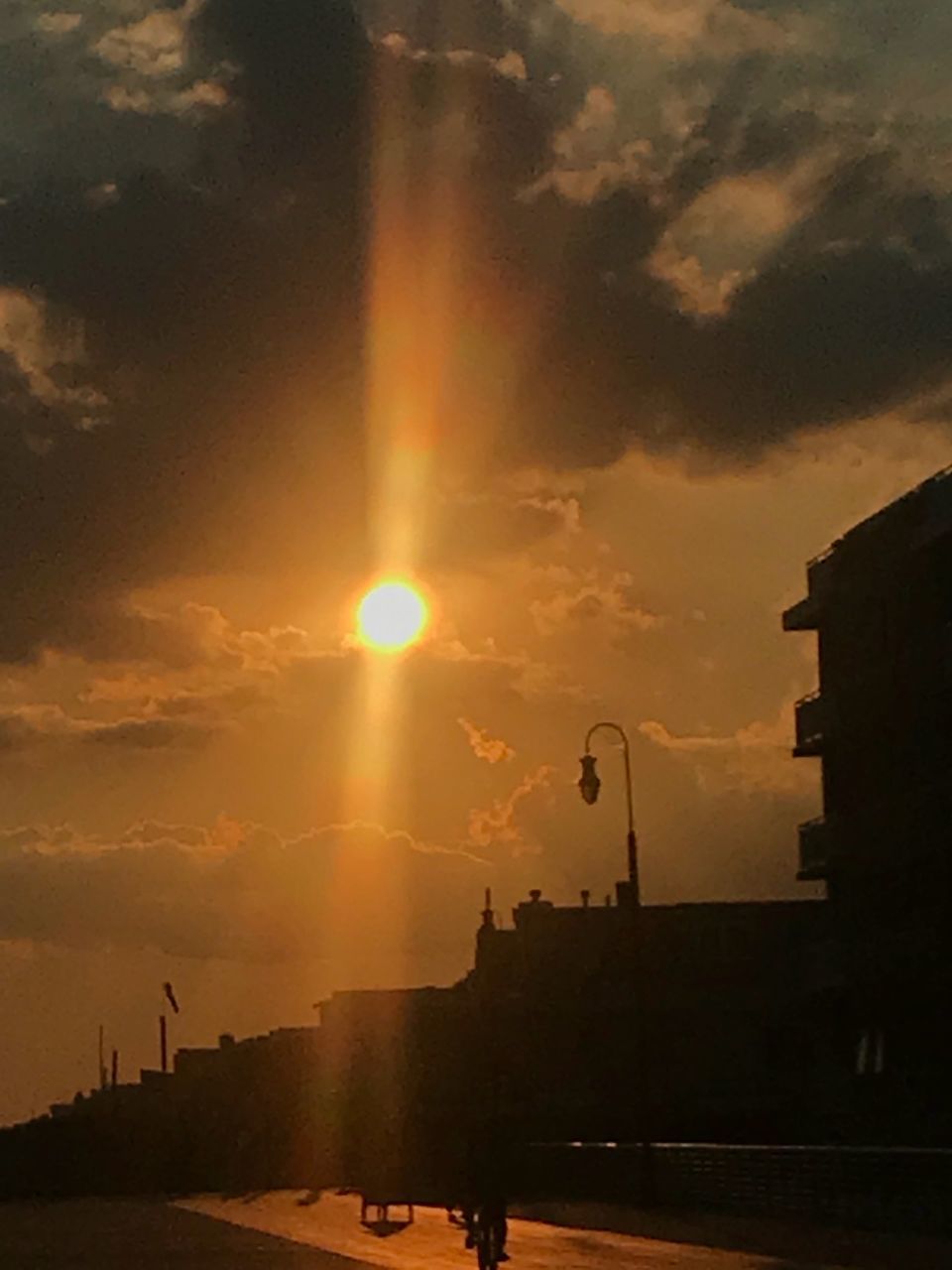 sunset, sky, cloud - sky, architecture, building exterior, built structure, sun, sunbeam, orange color, nature, lens flare, sunlight, no people, street, city, beauty in nature, street light, outdoors, building, transportation