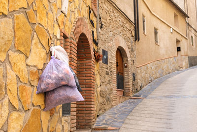 Rear view of woman walking in tunnel