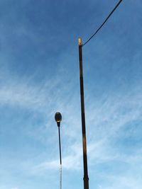 Low angle view of street light against sky