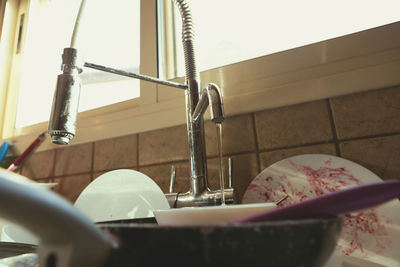 Close-up of faucet in container