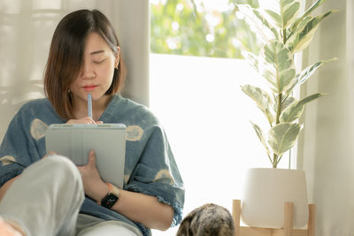 Asian woman use tablet meeting and working from home