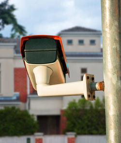 Close-up of vintage car against building