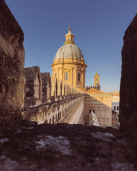 Low angle view of historic building against clear sky