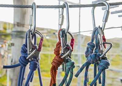 Close-up of padlocks hanging on metal chain