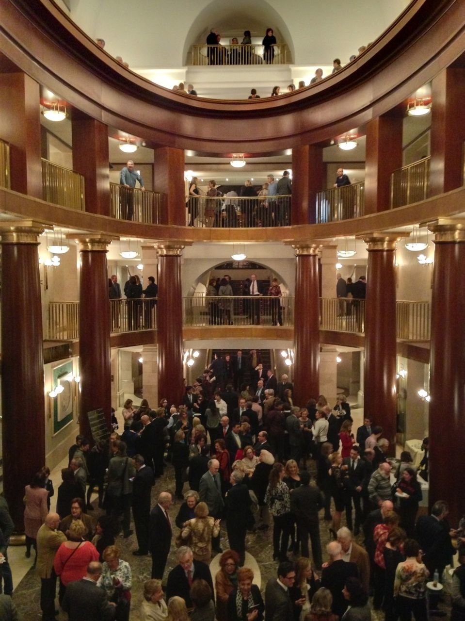 indoors, person, large group of people, men, lifestyles, architecture, leisure activity, built structure, illuminated, lighting equipment, place of worship, spirituality, religion, restaurant, crowd, window, table, architectural column