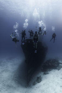 People scuba diving in sea