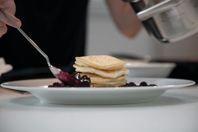Pancakes in plate on table