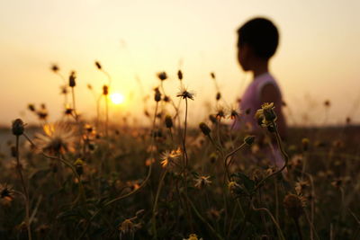 Woman standing on field