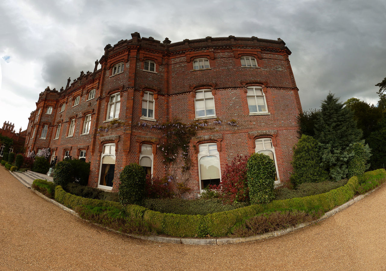 architecture, building exterior, built structure, sky, cloud - sky, window, cloudy, low angle view, building, tree, cloud, residential structure, day, residential building, outdoors, old, no people, house, city, wall - building feature