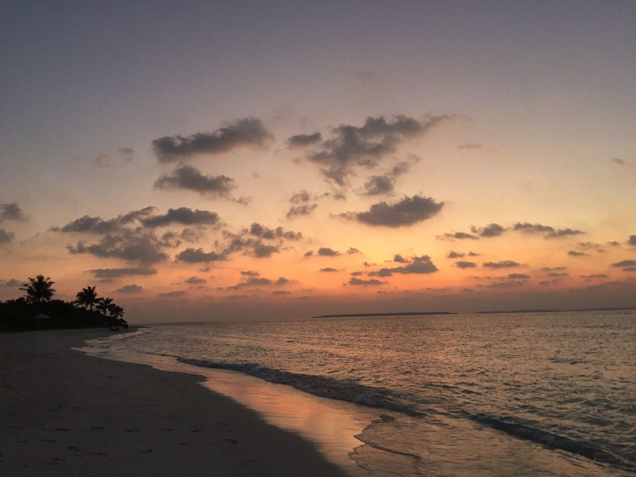 sea, horizon over water, sunset, water, beach, tranquil scene, scenics, tranquility, beauty in nature, sky, shore, nature, idyllic, orange color, coastline, sand, cloud - sky, outdoors, calm, no people