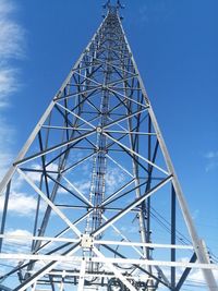 Low angle view of tower against blue sky