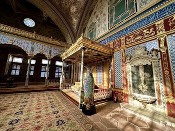 Rear view of woman standing in historic building