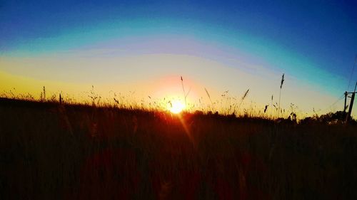 Scenic view of landscape at sunset