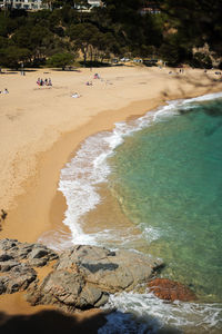Costa brava beach with turquoise water on sunny day
