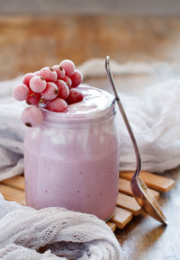 Close-up of strawberries in jar on table