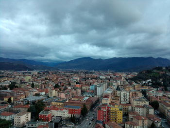 Cityscape against cloudy sky