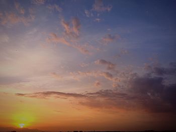 Scenic view of cloudy sky at sunset