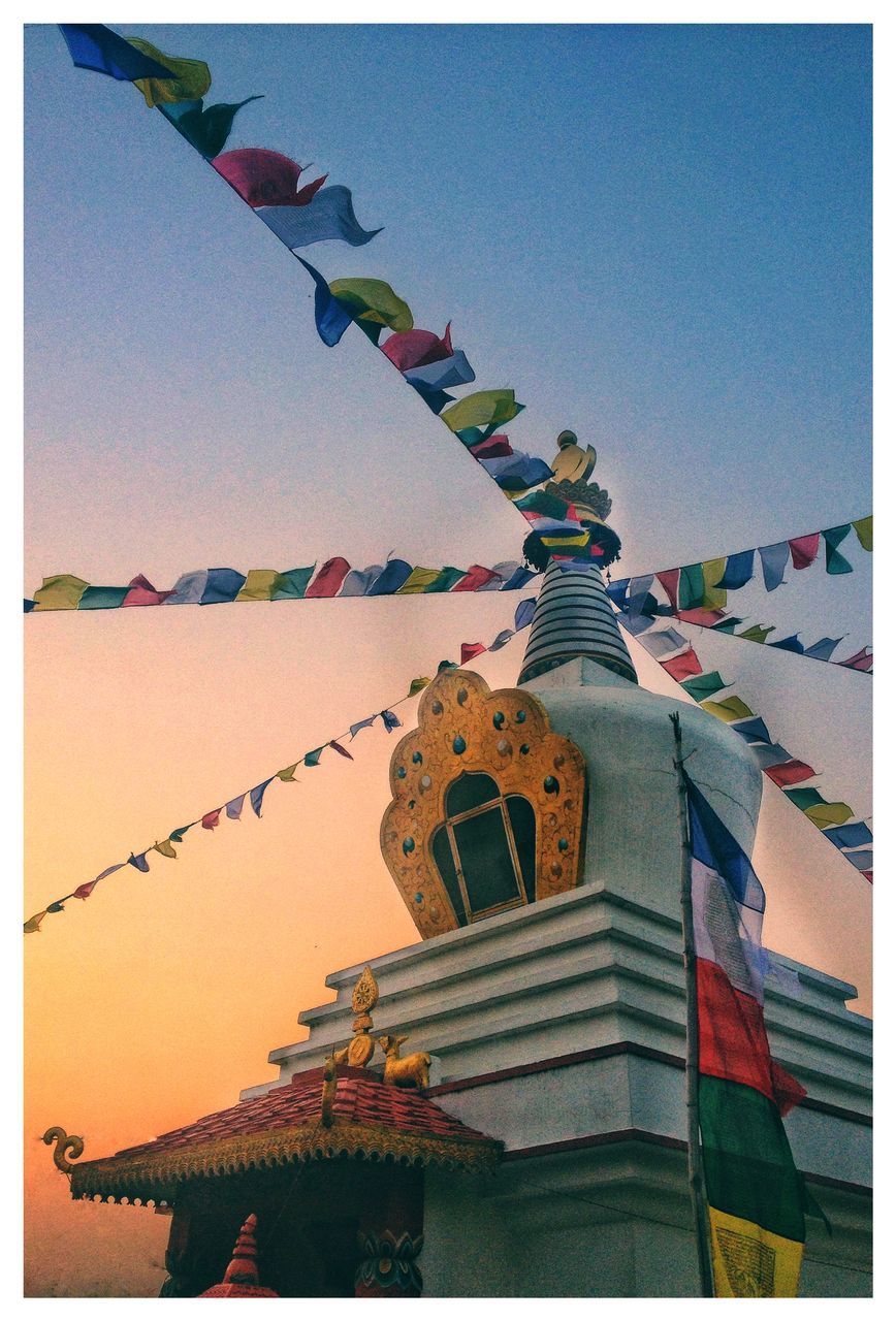 LOW ANGLE VIEW OF FLAGS AGAINST SKY