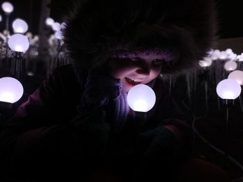 Portrait of woman with illuminated lights