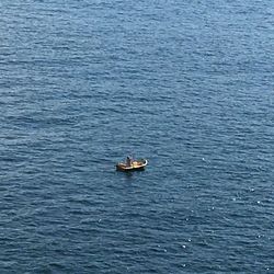 High angle view of people on boat sailing in sea